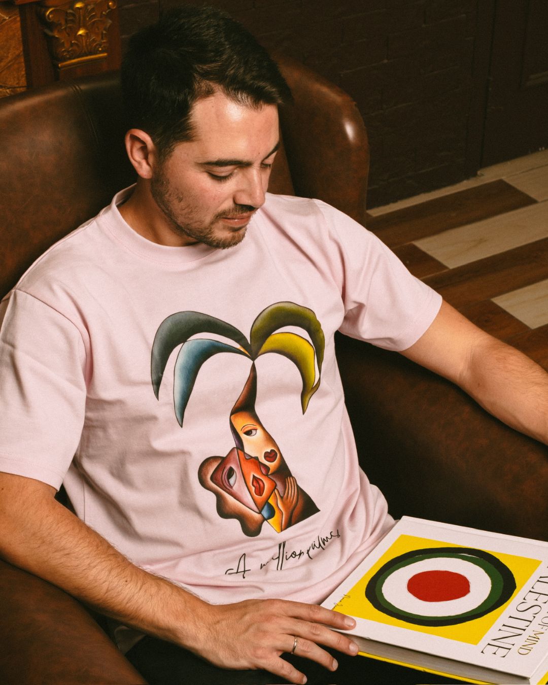 model wearing tshirt with palm tree artwork